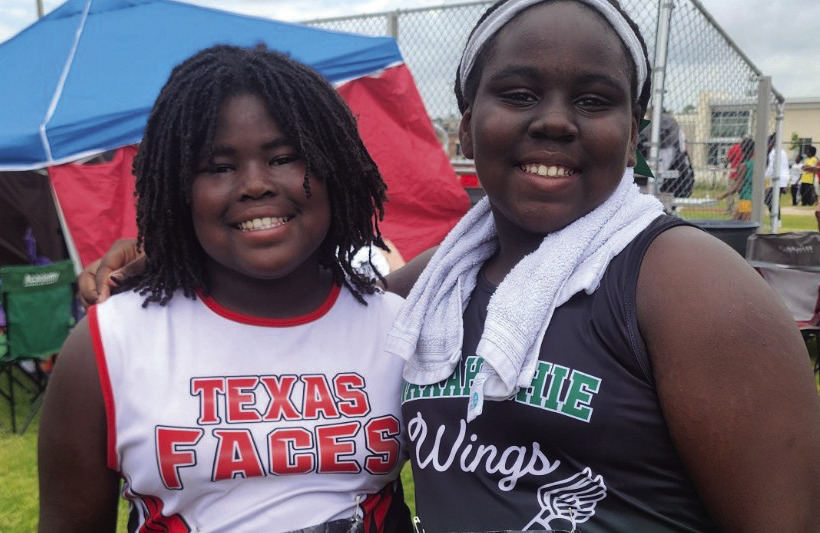 Different uniforms, one community. Jada of Texas Faces Track Club (left) and India Robinson of Waxahachie Wings share a moment on their road to nationals. Submitted Photo