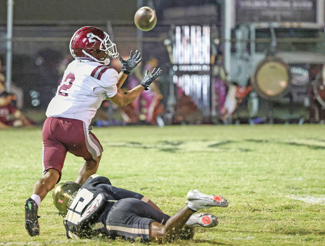 In the second quarter, Red Oak quarterback Billy Middleton dropped this pass over the shoulder of wide receiver Braden Robinson (2). This set up a Hawk’s touchdown two plays later. Photo by Steve Patterson / Moving Pictures.