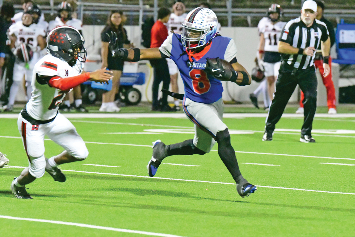 Za’ko Davis (8) rushed 8 times for 104 yards and scored three first half touchdowns in Heritage’s win over Dallas Hillcrest. Photo by Fred Phipps.