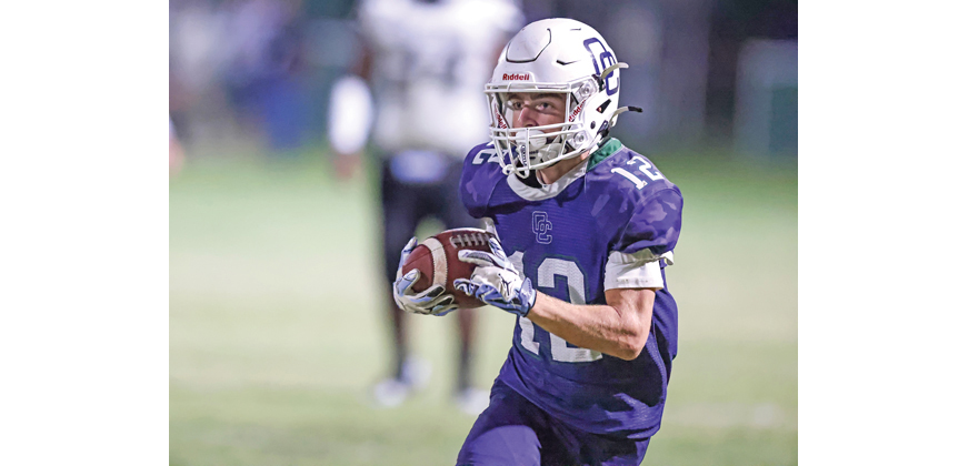 Greyson Scott (12) rushes towards the sideline in the 3rd quarter. Photo by Steve Patterson / Moving Pictures