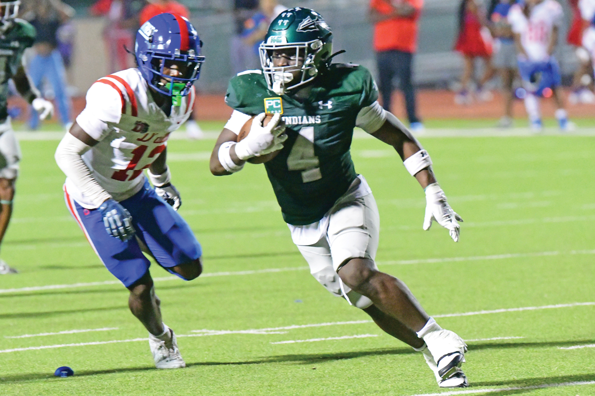 Waxahachie Quarterback Jerry Meyer III threw an 11-yard touchdown pass to running back Taylen Furlough-Strange (4), who put the Indians on the board early. Photo by Fred Phipps.