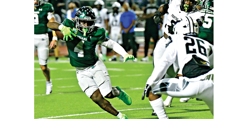 Taylen Strange (4) rushed 21 times for 81 yards and caught 2 passes for 43 yards in the effort. Photo by Fred Phipps