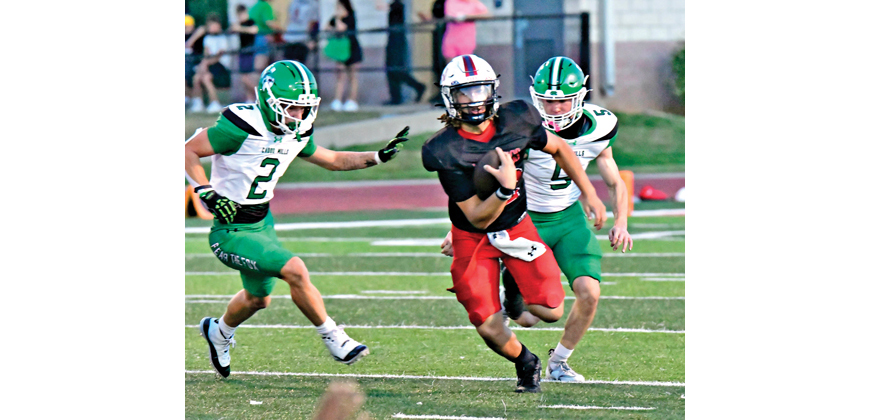 Mustang QB Jaxon Kirkpatric (12) was 12 of 17 for 128 yards and 1 interception. Photo by Fred Phipps