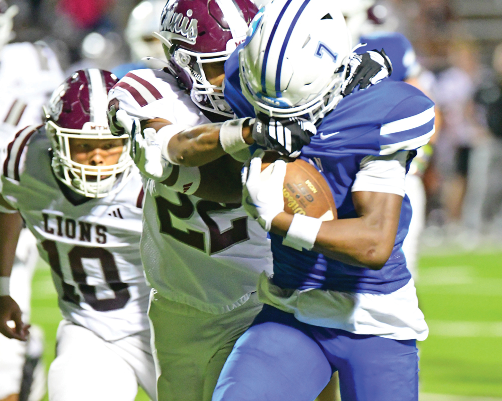 Kentorian King (7) had a big night for Midlothian. The junior had 154 yards and a score on six receptions and added 83 yards and two touchdowns on the ground. Photo by Fred Phipps.