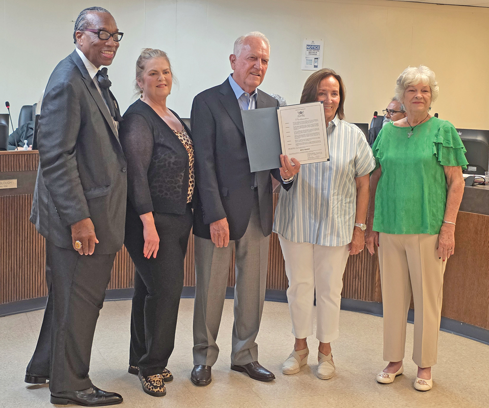Pictured are Dallas County Commissioner John Wiley Price, Councilwoman Laura Jacobs, Mike Rader, his wife Marilyn and Wilmer Mayor Sheila Petta.