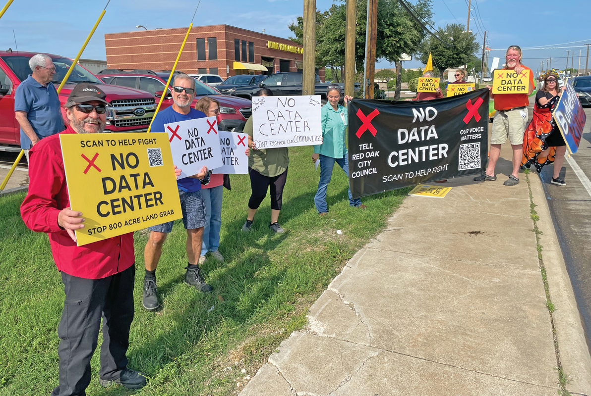A group of Red Oak residents showed their opposition to the proposed 800+ acre data center development in Red Oak by standing on the north side of FM 664 waving signs last week. Photo by Charles D. Hatfield Jr. / The Ellis County Press.