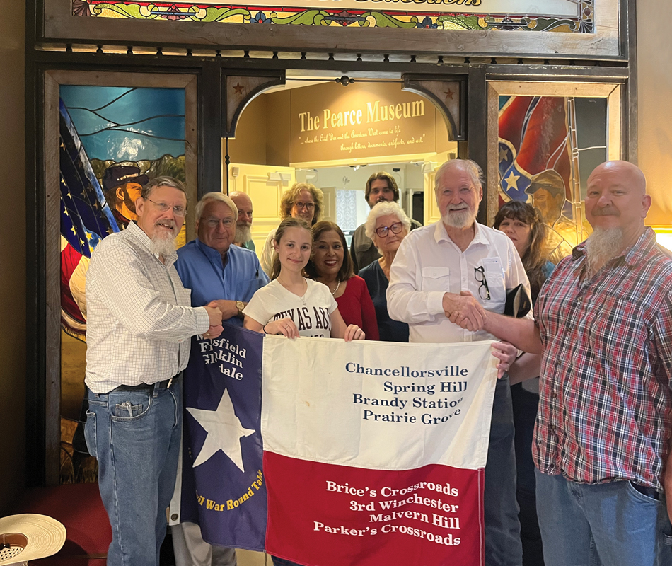 Parsons Camp members Rob Jones, far left, and Wade Gardner, far right, welcome Austin Civil War Round Table members to the Pearce Museum Civil War Collection. Photo courtesy Parsons Camp #415, SCV.