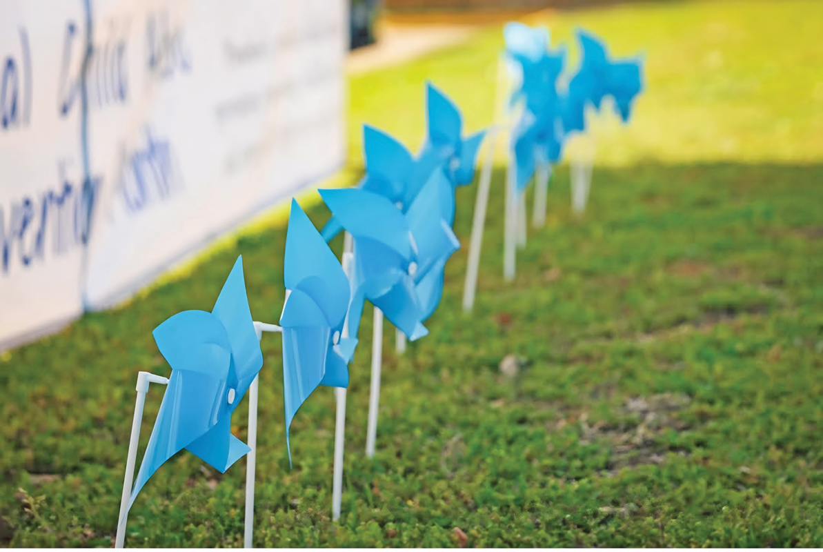 Blue pin wheels and banners around Ellis County spin because the county is committed to painting the town blue on behalf of National Child Abuse Prevention Month. Photo courtesy Red Oak Police Department Facebook.