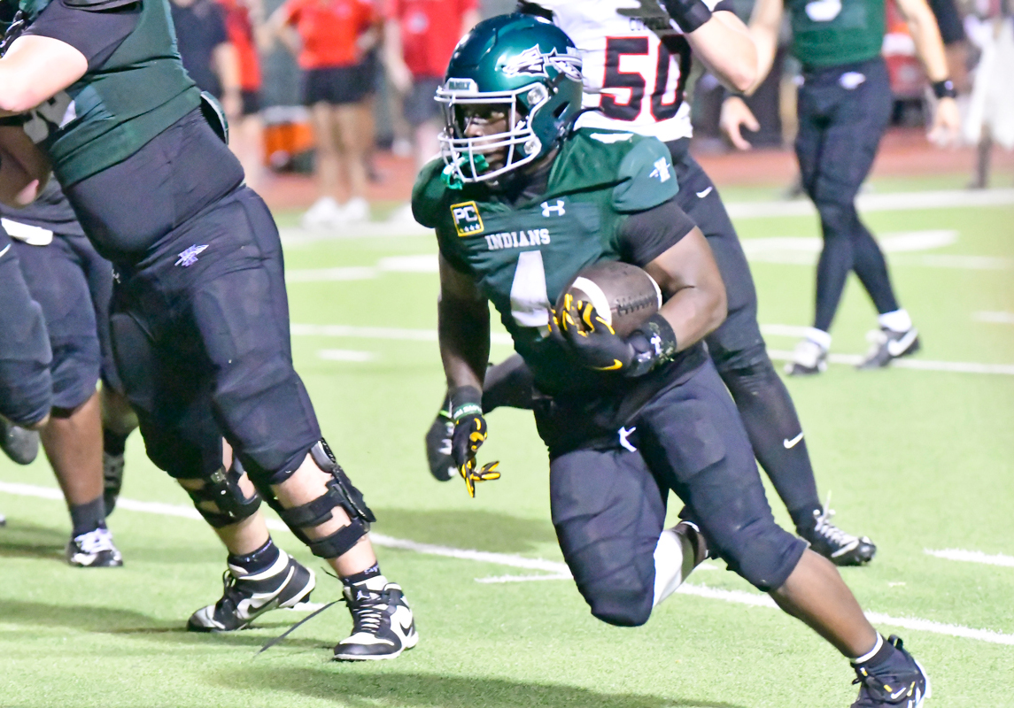 Junior running back Taylen Strange (4) took off on a 13-yard touchdown run with 1:55 left to beat Coppell 27-24. Photo by Fred Phipps