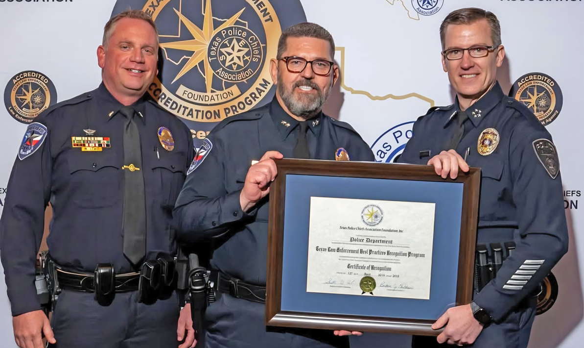Waxahachie Police Department received its fourth consecutive accreditation certification from the Texas Police Chiefs Association last week. Pictured are Lieutenant Mike Lewis, Chief Joe Wiser, and TPCA President Chief Will Johnson. Submitted photo.