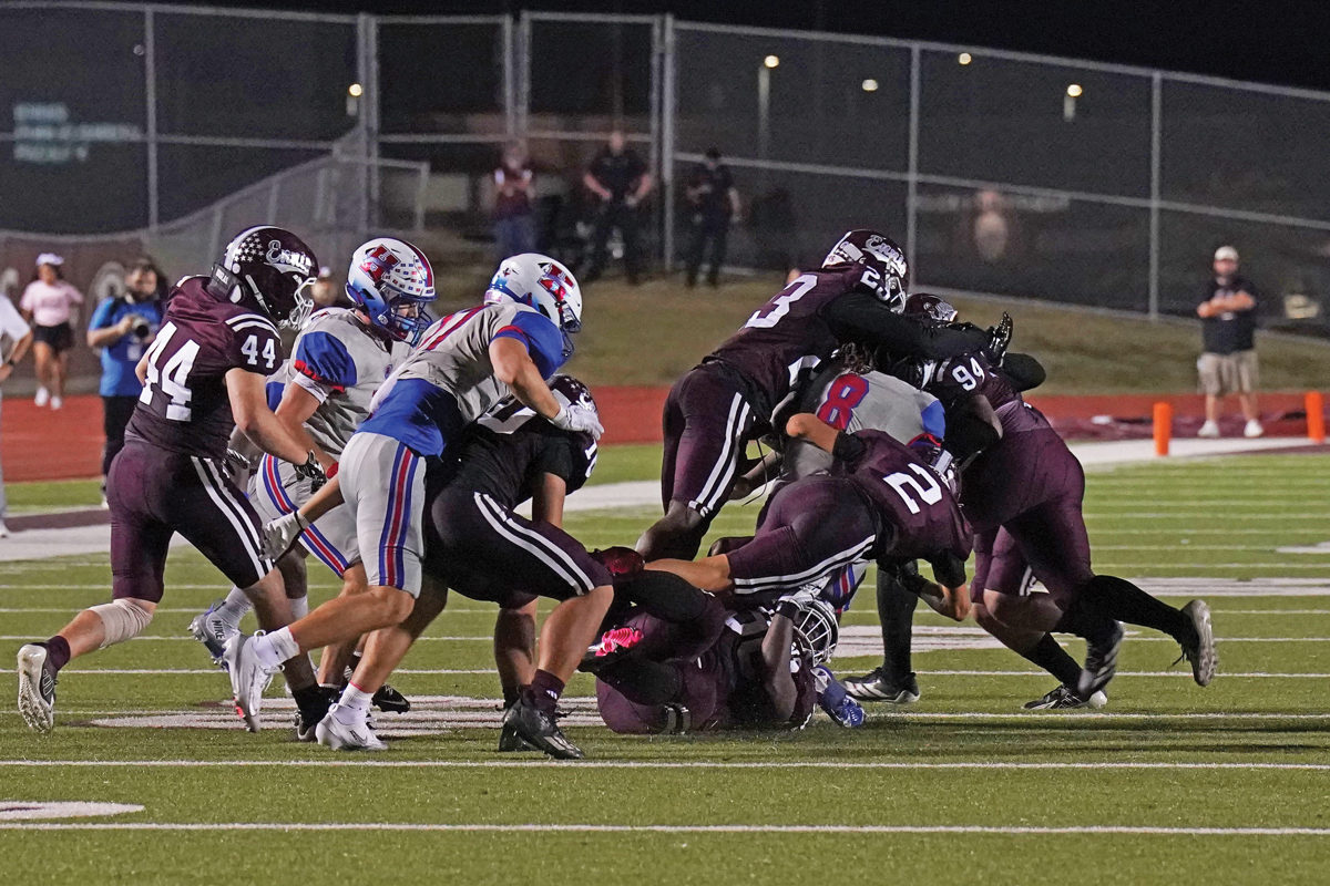 One of the few times Ennis’ defense stopped Za’ko Davis (8). Davis rushed for 33 yards and a touchdown, and also had 17 receptions for 90 yards and another TD in the win. Photo by Lezley Norris.