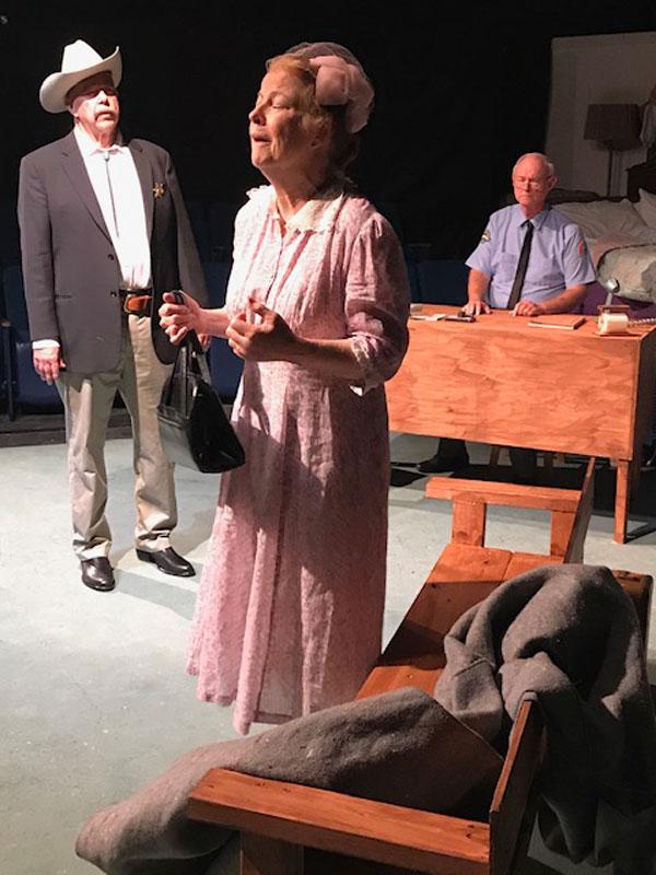 Carrie Watts (Johnna Leigh) pleads with the sheriff (Paul Perry) and Roy (Bill Walker) to let her return to her home place in Theatre Rocks! production of “The Trip to Bountiful.”