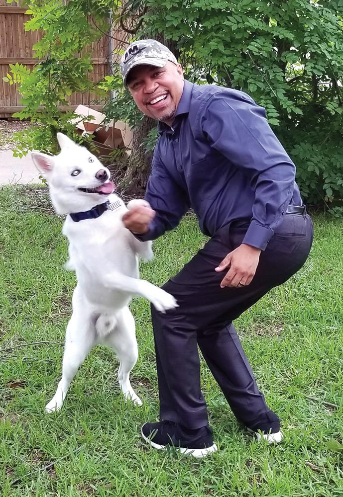 Virgo and State Representative, Carl Sherman, District 109, enjoy play time together.