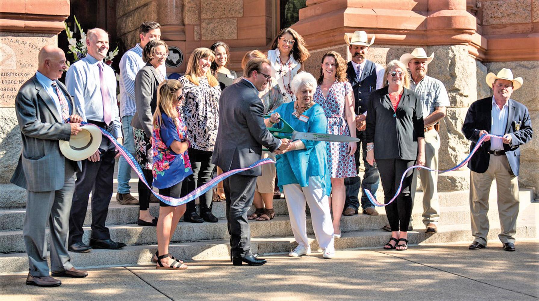 A ribbon cutting was held earlier this month to celebrate the re-opening of the four doors at the historic Ellis County Courthouse.