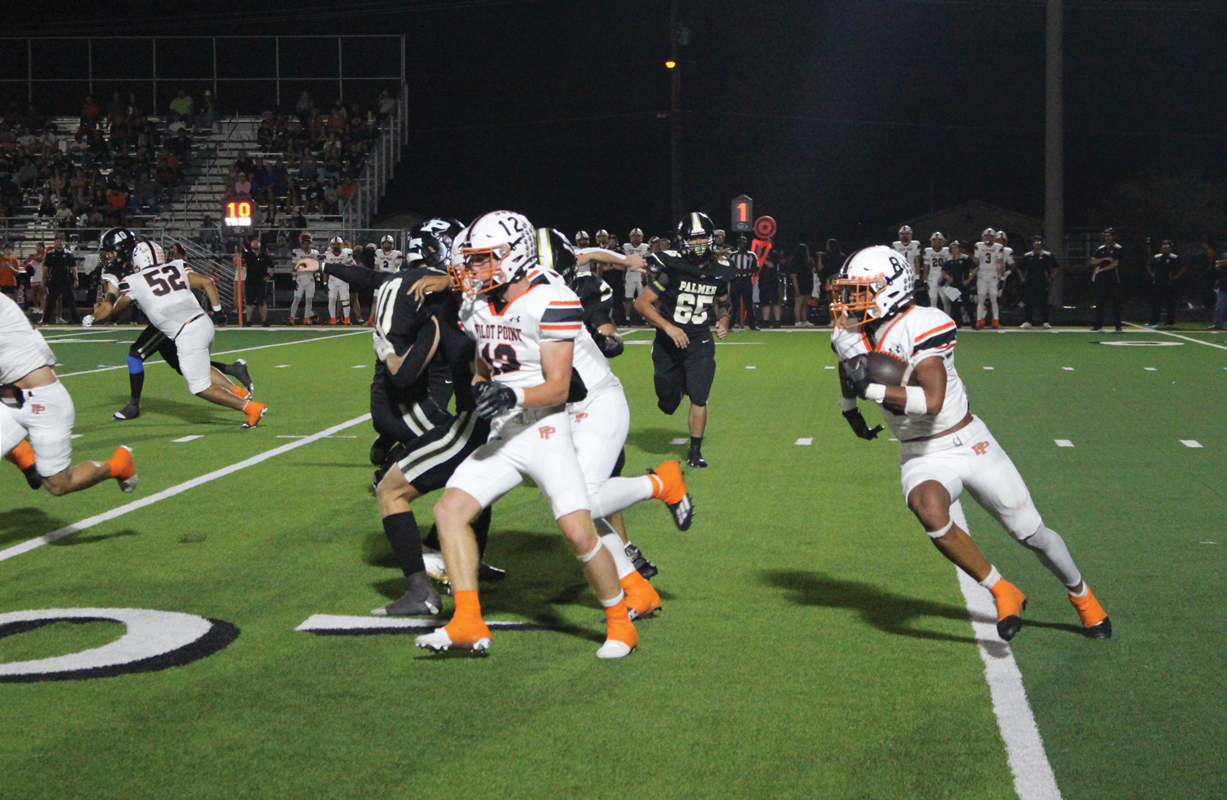 Pilot Point running back Josh Chumley (8) had 17 carries for 100 yards and a touchdown in the 44-28 win against undefeated Palmer. Photo by Michael Seiber / The Ellis County Press.