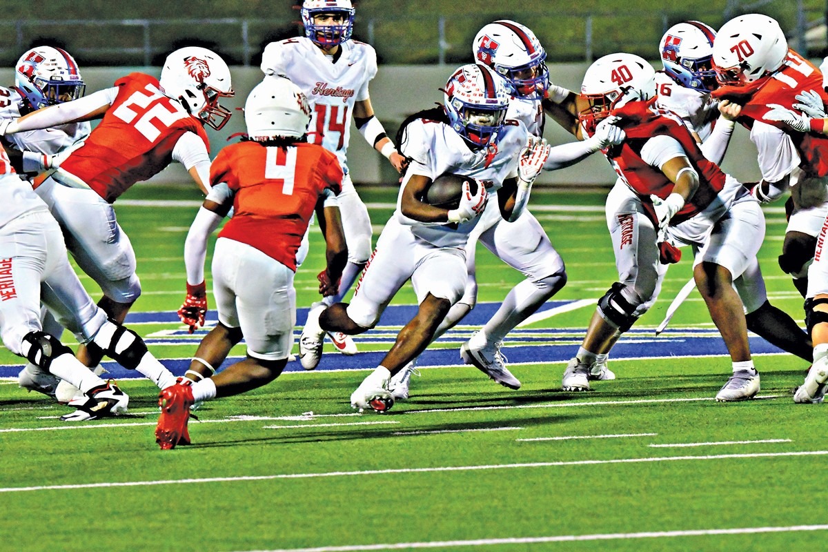 Heritage’s Za’ko Davis (8) carried 12 times for 84 yards and had 6 catches for 40 yards including a touchdown from 12 yards out. Photo by Fred Phipps.