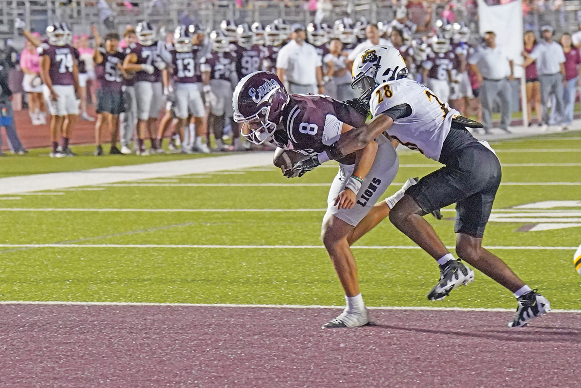 Ennis quarterback Chris Martinez (8) led Ennis to victory over the Crandall Pirates with four total touchdowns (2 rushing and 2 passing) and over 275 all purpose yards. Photo by Lezley Norris.