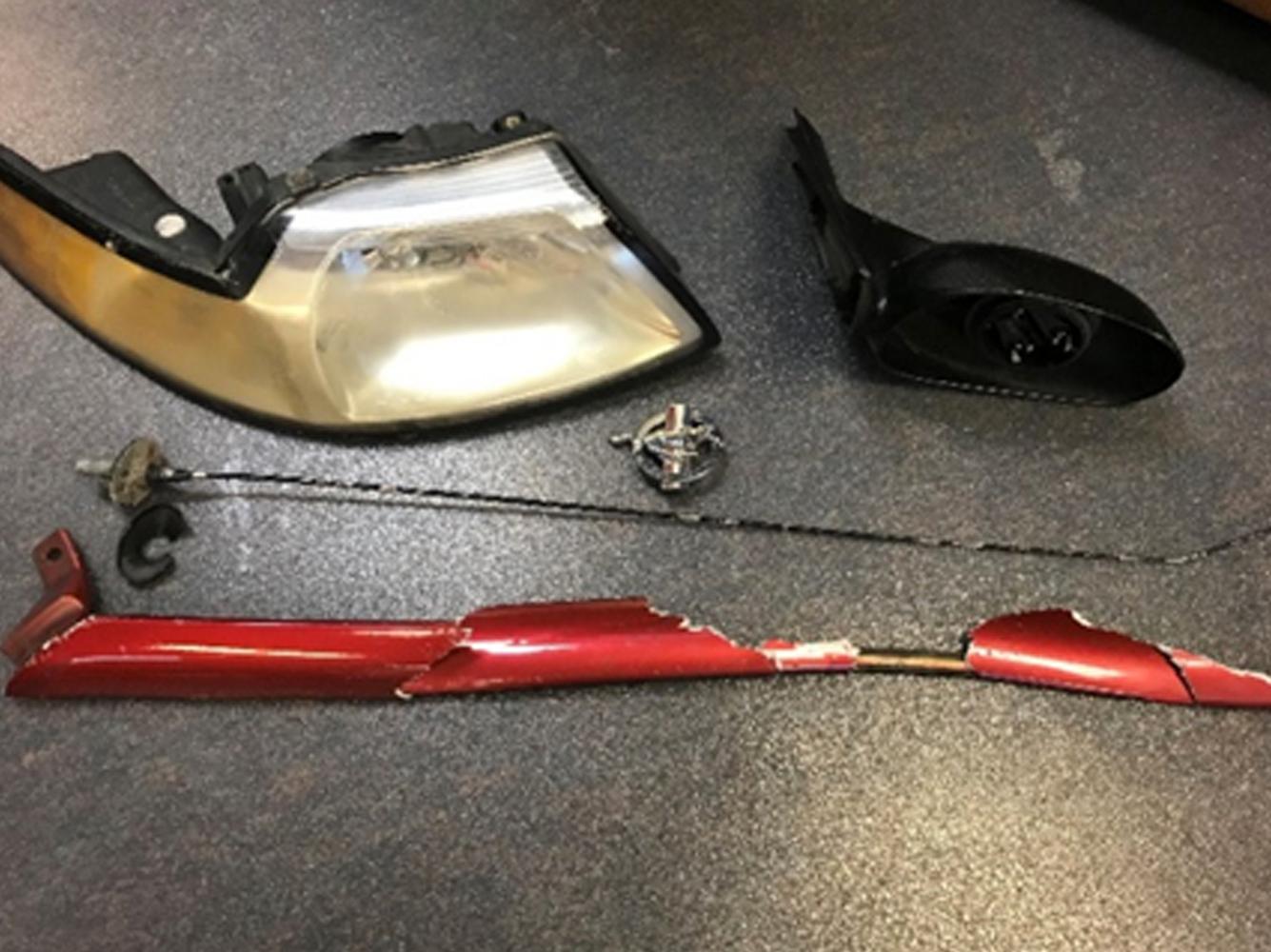 Evidence left at the scene from a 1999 maroon Ford Mustang.