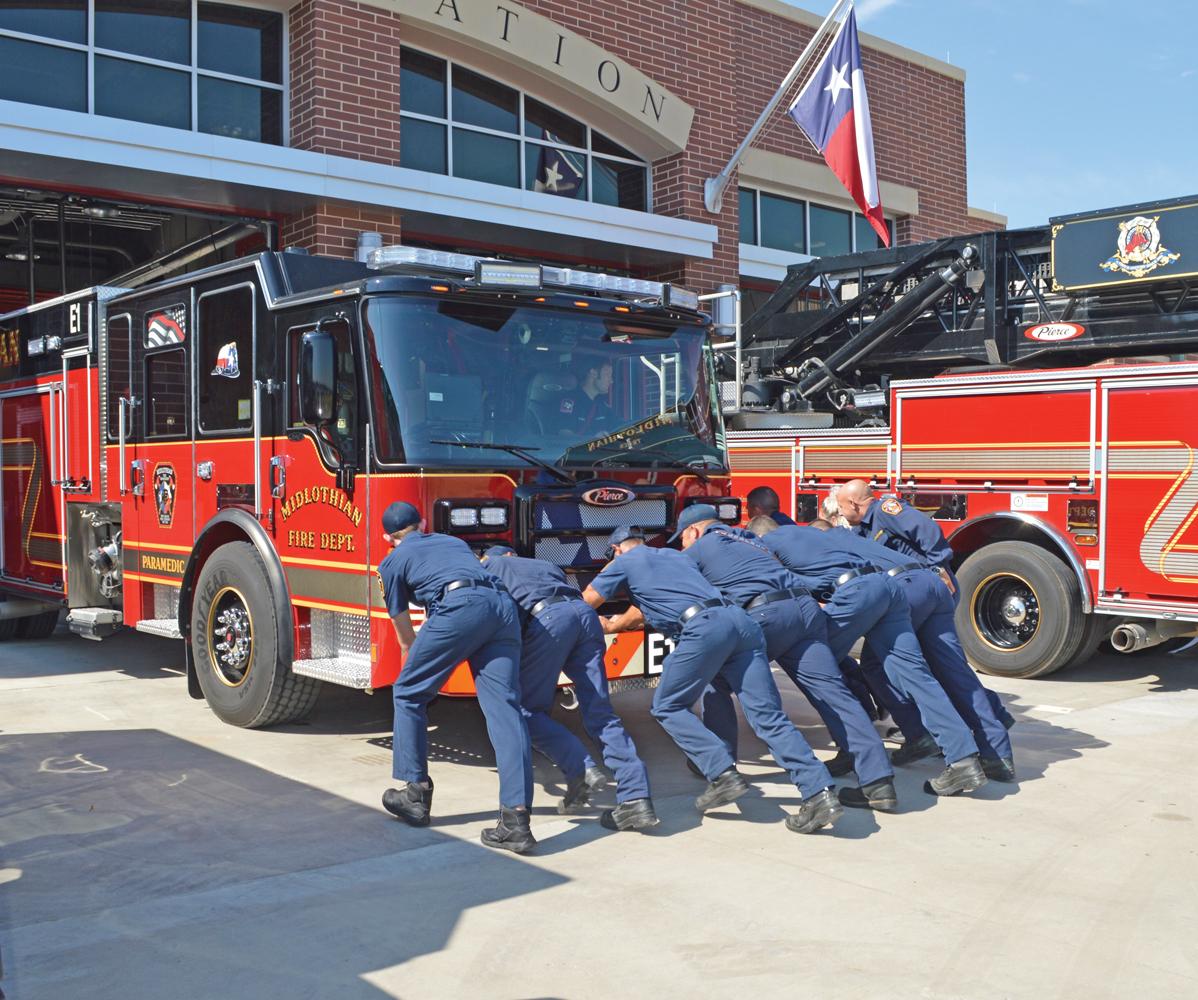 Midlothian firefighters pushed Engine No. 1 into the apparatus bay, a tradition that dates back to the days when fire wagons were powered by horses who had difficulty walking backwards.