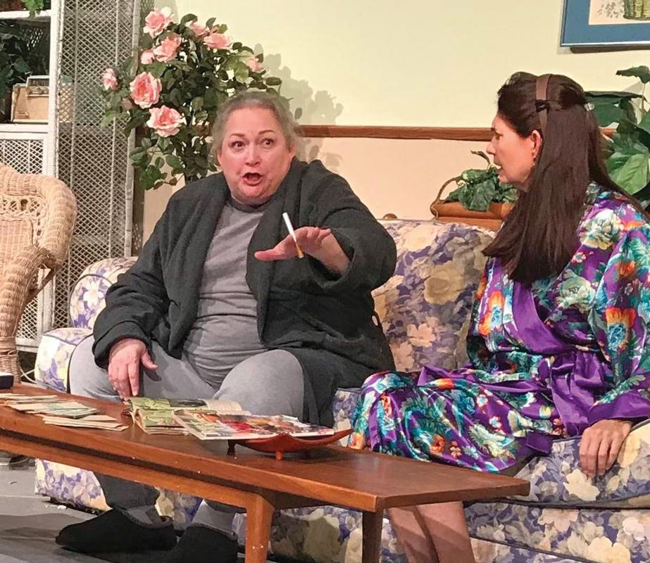Miss Alice and Mr. Taylor: Miss Alice (Debra Hinson, left) is in danger of falling for the charms of Mr. Taylor (Jon Kirk Race) in the dark comedy, “Big Boy, Miss Alice and the Colonial Encyclopedia Salesman.” 