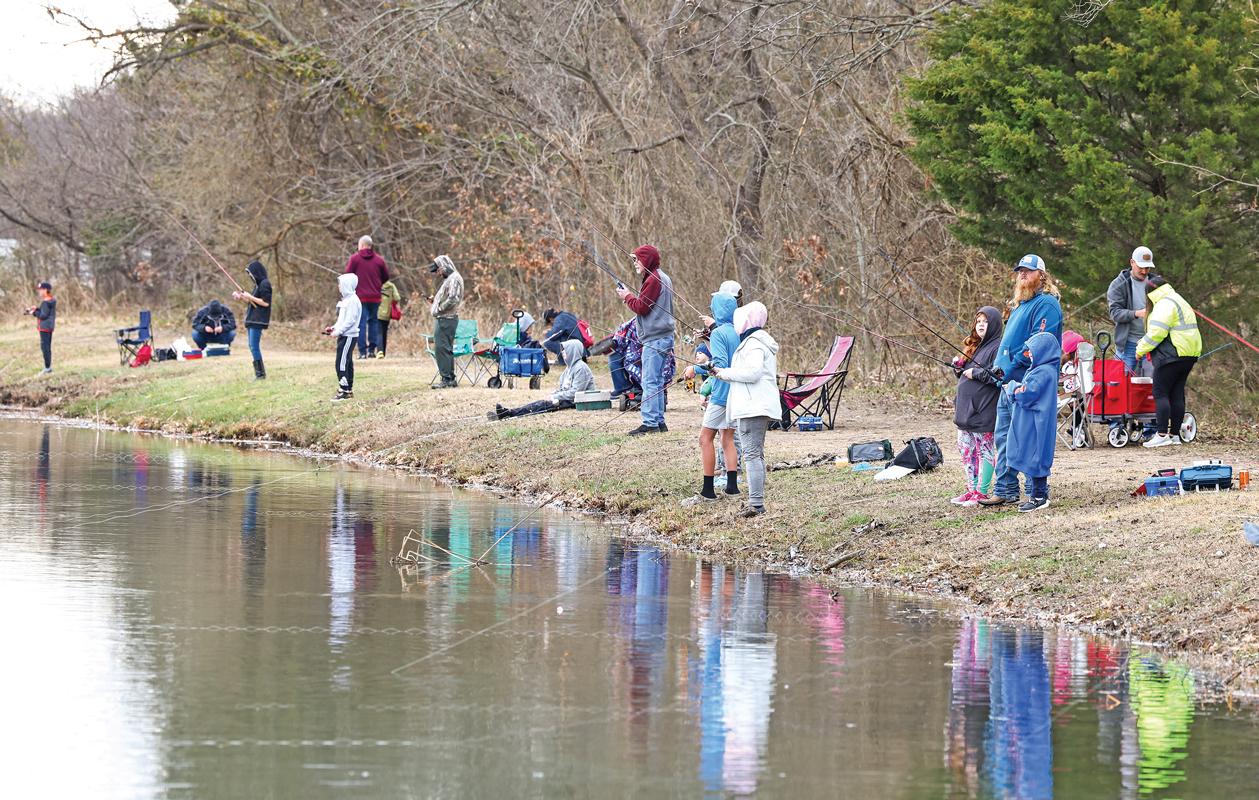 Fishermen lined the banks of Red Oak Municipal Lake hoping to catch a legal-size Trout.