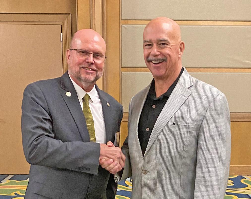 County Commissioner Paul Perry, pct. 3, right, was honored recently by the Texas Association of Counties for five years of pursuing excellence in his county investment education during the 2022 Conference of the County Investment Academy held in Galveston June 27-29.