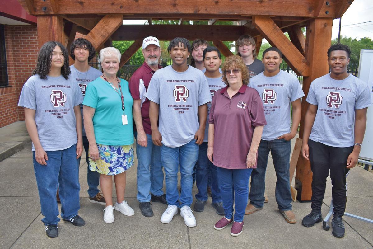Student construction team members Hunter Allen, Paul Armendariz, Mark Birmingham, Finel Brown, Dwayne Green, Evan Hernandez, Kyle Williams, Bennie Wilson and Aceson Womack with ROISD Board members Donna Knight, Johnny Knight, and Melanie Petersen.
