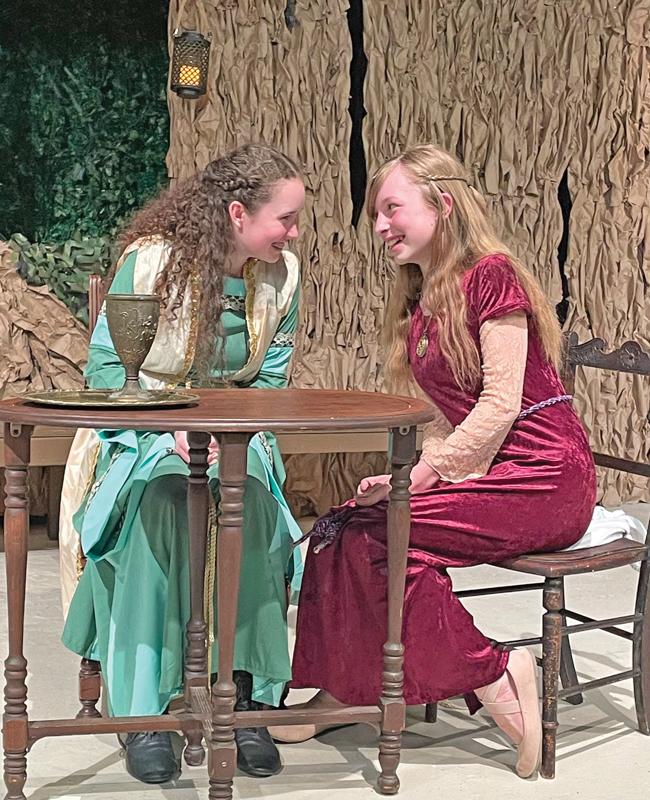 Maid Marian (Charlotte Robie of Ennis) and Lady Beatrice (Regina Zmolik of Ennis) share some tales of Robin and his Merry Men in “A Merry Adventure of Robin Hood,” which opens March 28 at Theatre Rocks! in Ennis.