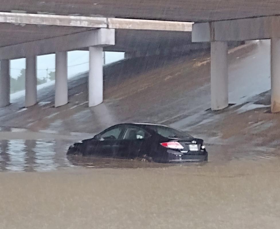 As the downpour continued, at least one car got stuck under the overpass at the 5th Street exit in Ferris. Photo by Terrance Murphy.