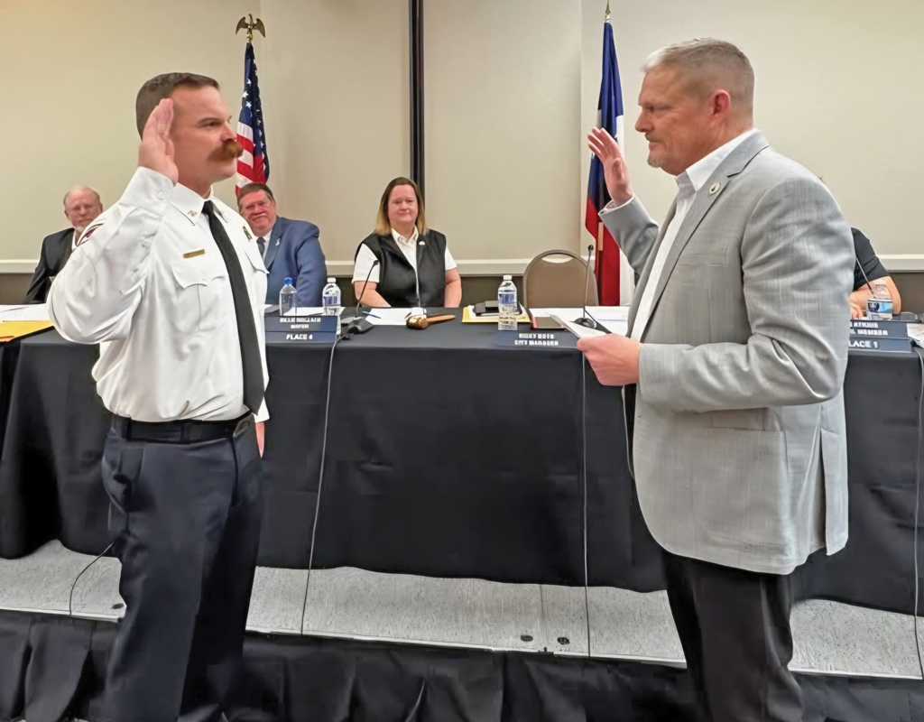Safford was officially sworn in as the new WFR Fire Chief by former Waxahachie Fire Chief and new City Manager Ricky Boyd. Submitted photo.