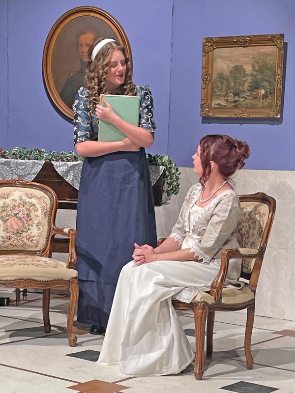 Mary Bennet (Amy Zollinger) has a compulsion for facts that sometimes exasperates her sister Elizabeth Darcy (seated, Jessica Kovar) in “Miss Bennet: Christmas at Pemberley,”  runs through Dec. 22  at Theatre Rocks, 505 NW Main St. in Ennis.