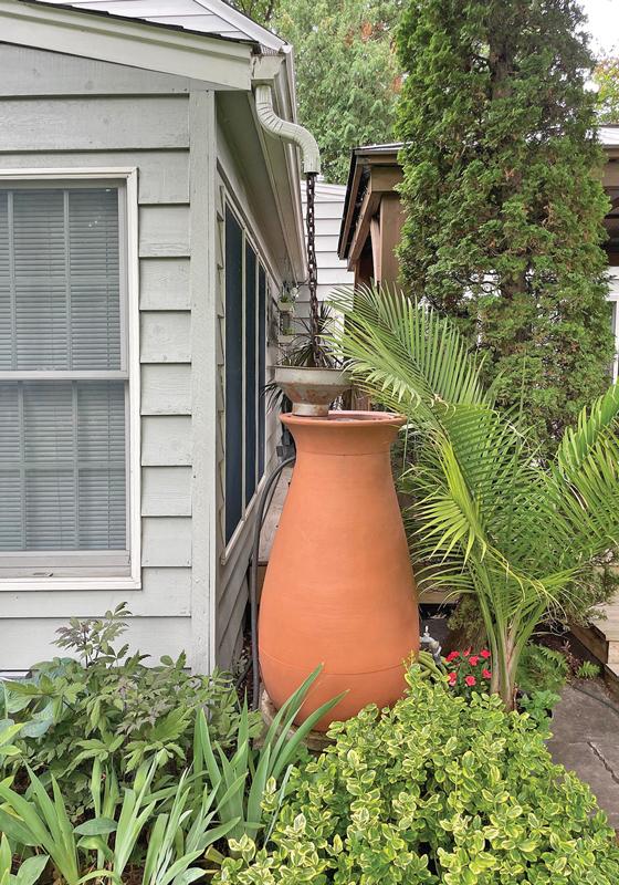 Rain barrels can help manage the water on your property and provide water to use in your gardens. 