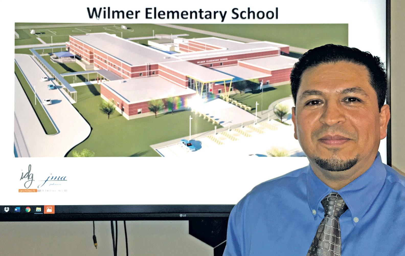Joe Flores, Wilmer’s new development services director, oversees the new elementary school from several vantage points.
