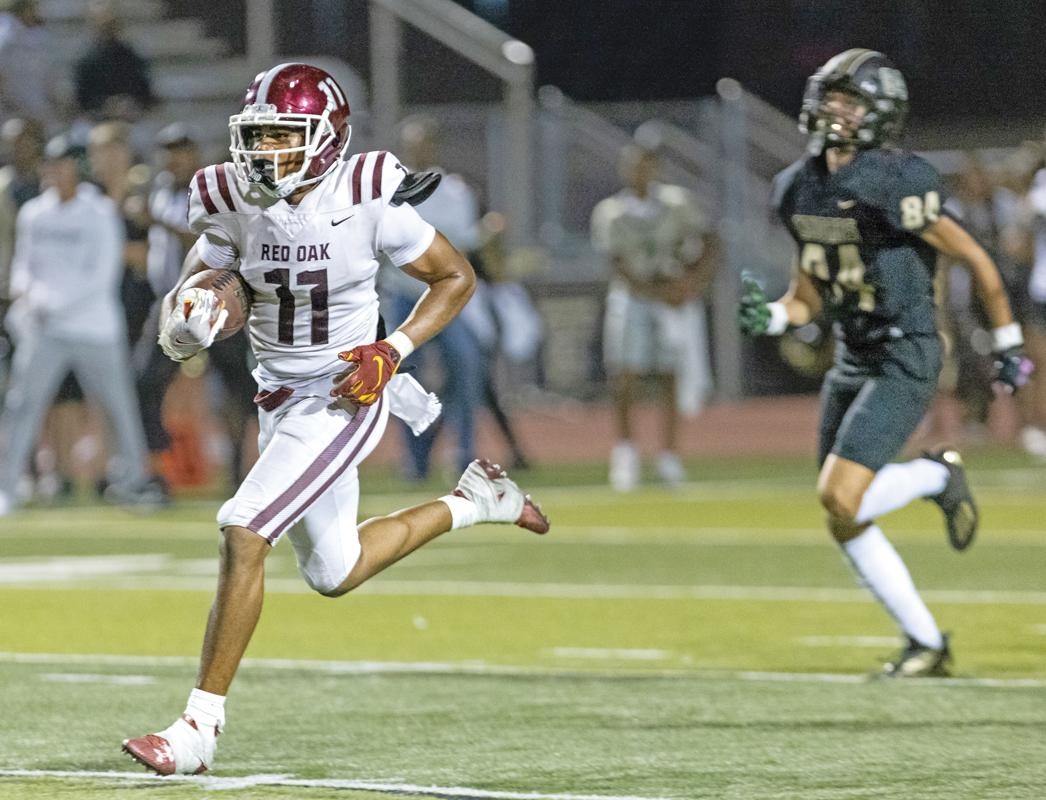 Senior linebacker Mehki Williams (11) was the recipient of the Thompson (5) blocked PAT and ran the ball back for the 2-point conversion.