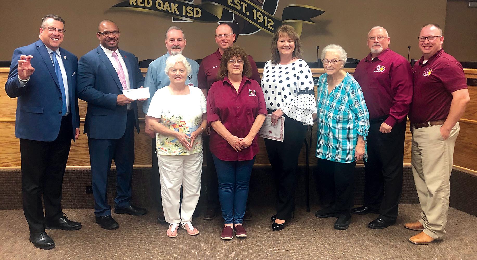 Ginger Kelley, Victron Energy assistant vice president, presented the grant checks to the district at the June 18 school board meeting.