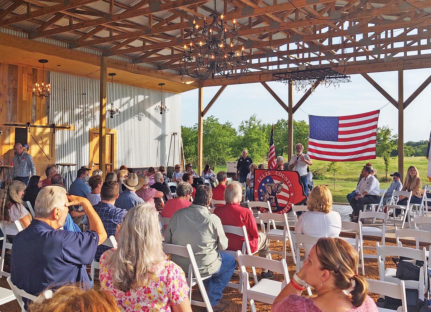 Ellis County GOP Chair Randy Bellomy is shown conducting the meeting on July 7.