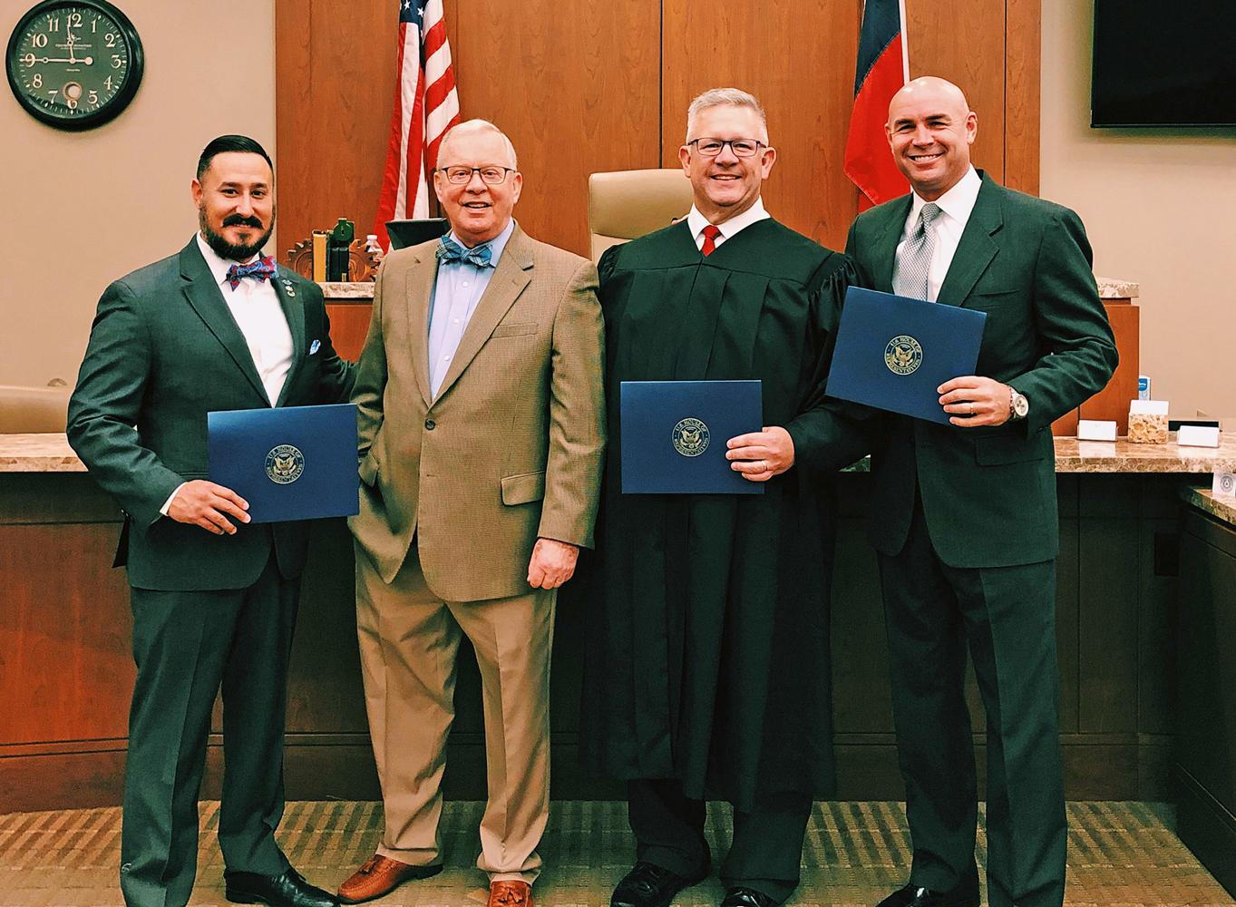 Sam Bryant is shown with Cong. Ron Wright, District Judge William D. Wallace and Jake Ellzey.