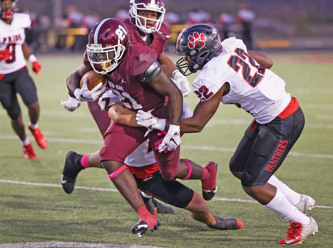 Running Back Moses Martindale (21) splits the defense on this carry for the Hawks.