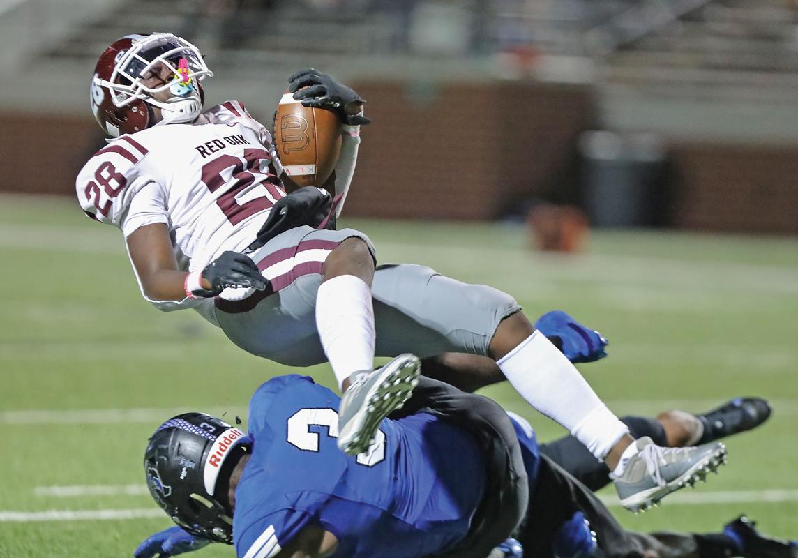 Jerome Harris (28) gets upended on this carry late in the 4th quarter. 