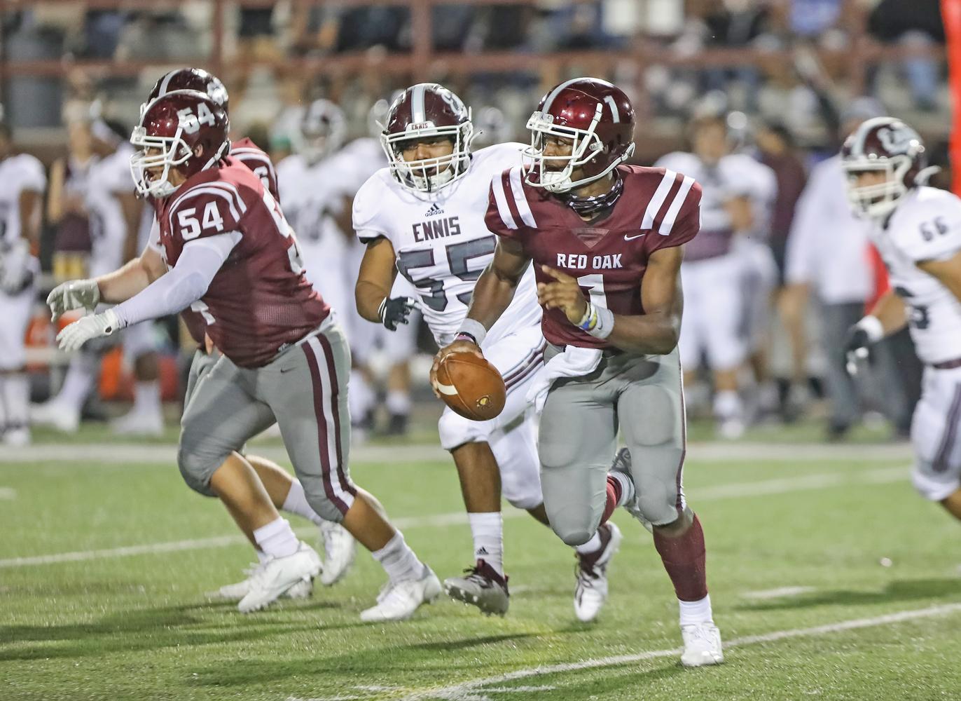 Duncanville transfer Chris Parson (1) came in as QB and sparked some life into the Hawks offense with his ability to extend plays, both with his legs and arm. Photo by Steve Patterson / Moving Pictures
