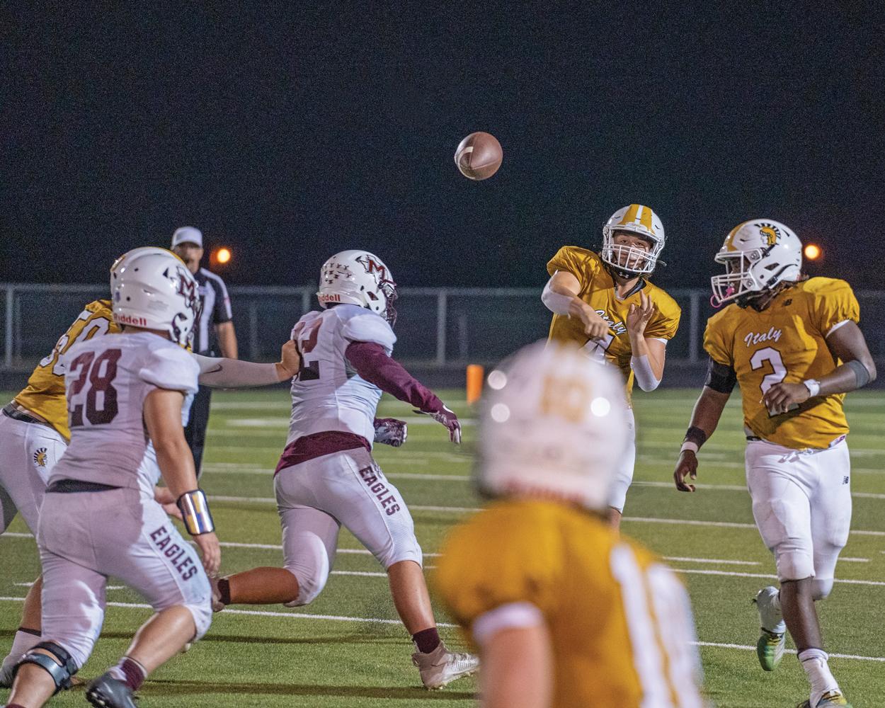 QB Jayden Saxon (4) completes pass over the middle to Kort Holley (10). Photo by Kirk Holt.