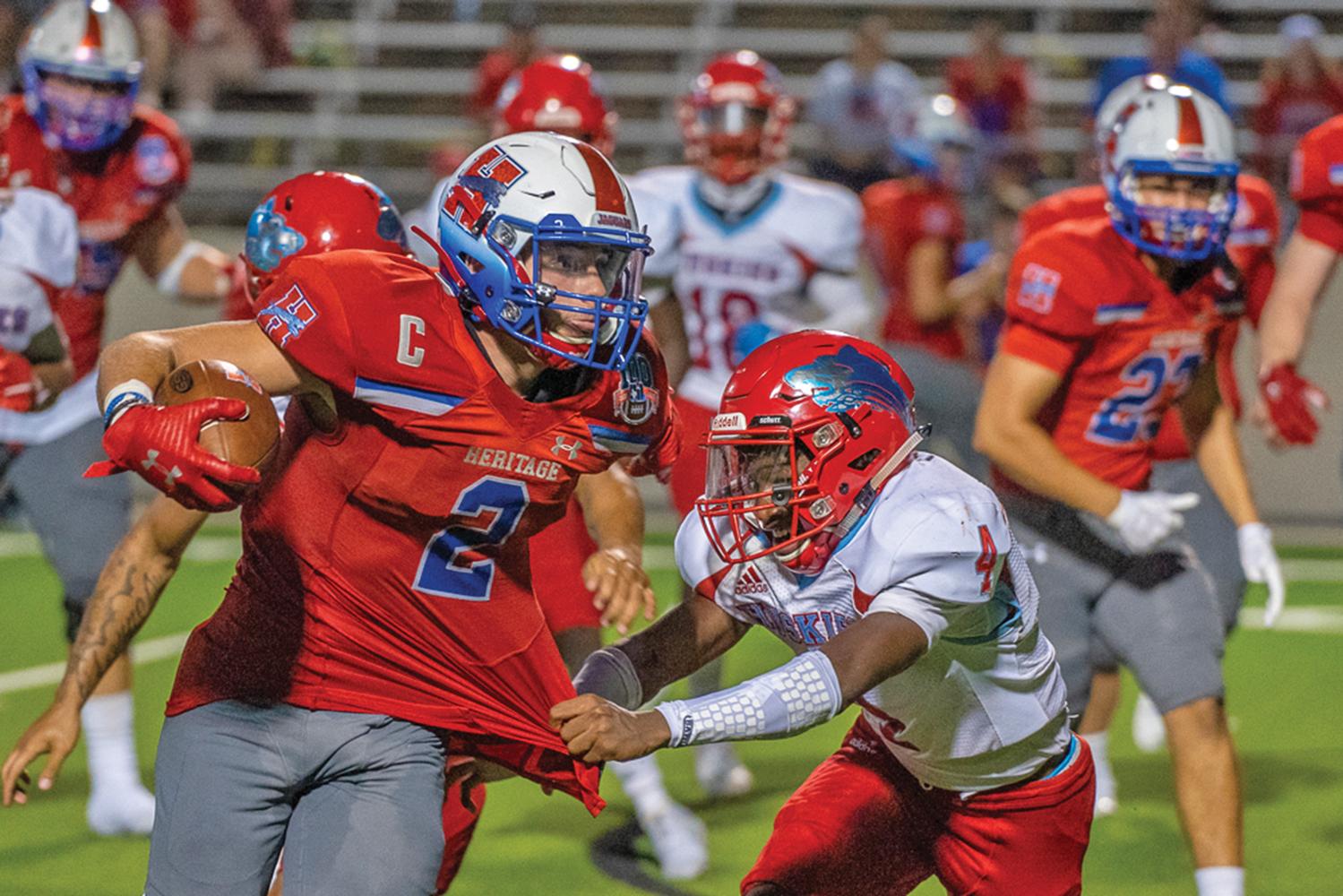 Cullen Stone (2) fights through for extra yards. Photo by Kirk Holt.