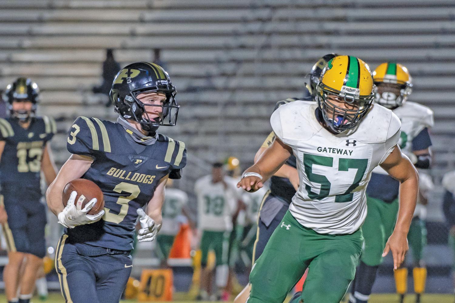 Drew Powell (3) rounds the corner looking for the end zone. Photo by Kirk Holt.