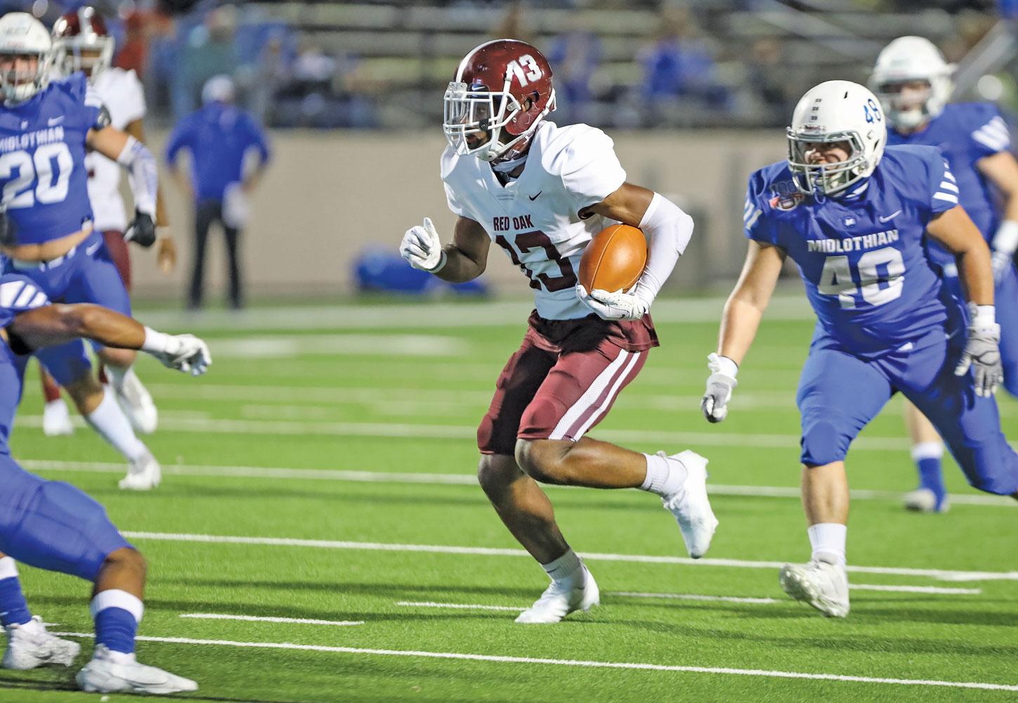 WR Triston Edwards (13) splits defenders and runs up field after catching a pass from Joshua Erving (2). Photo by Steve Patterson / Moving Pictures.