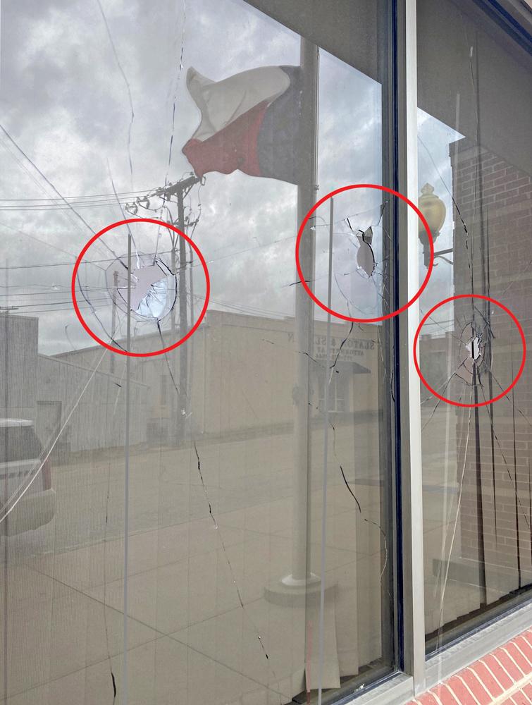 Someone threw a railroad track ballast through the front window of the Wayne McCollum Detention Center in Waxahachie sometime Friday night or Saturday morning.