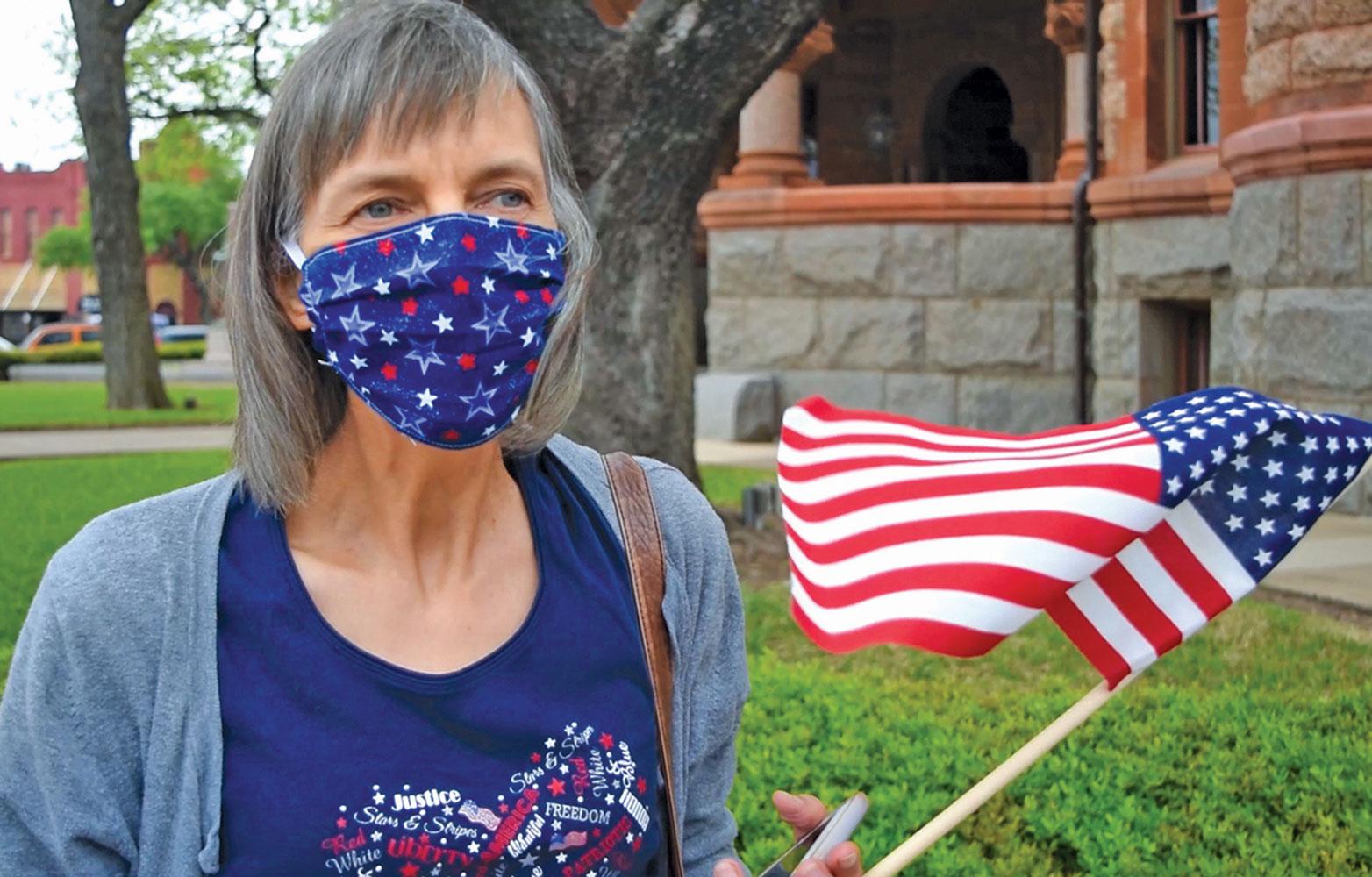 One woman at the protest who donned a mask said she was surprised that JOANN Fabrics and Crafts could remain open as an essential business, yet HobbyLobby had been closed during the lockdown.