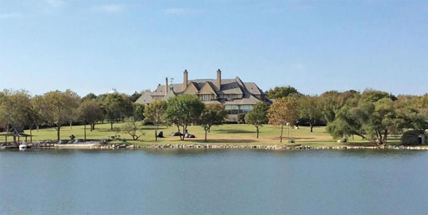 At the heart of the ranch is a gated compound featuring a 23,000-square-foot stone mansion, built in 2000 by Tommy and Cory Ford and overlooking a lake. 