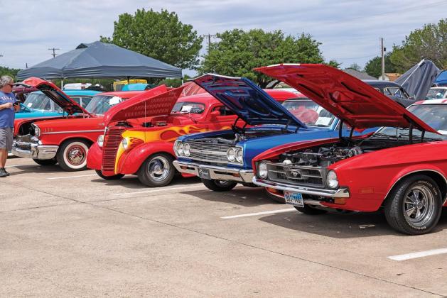 Rows of classic muscle cars lined up in front of Red Oak Middle School for the ROHS FFA Club’s car show.