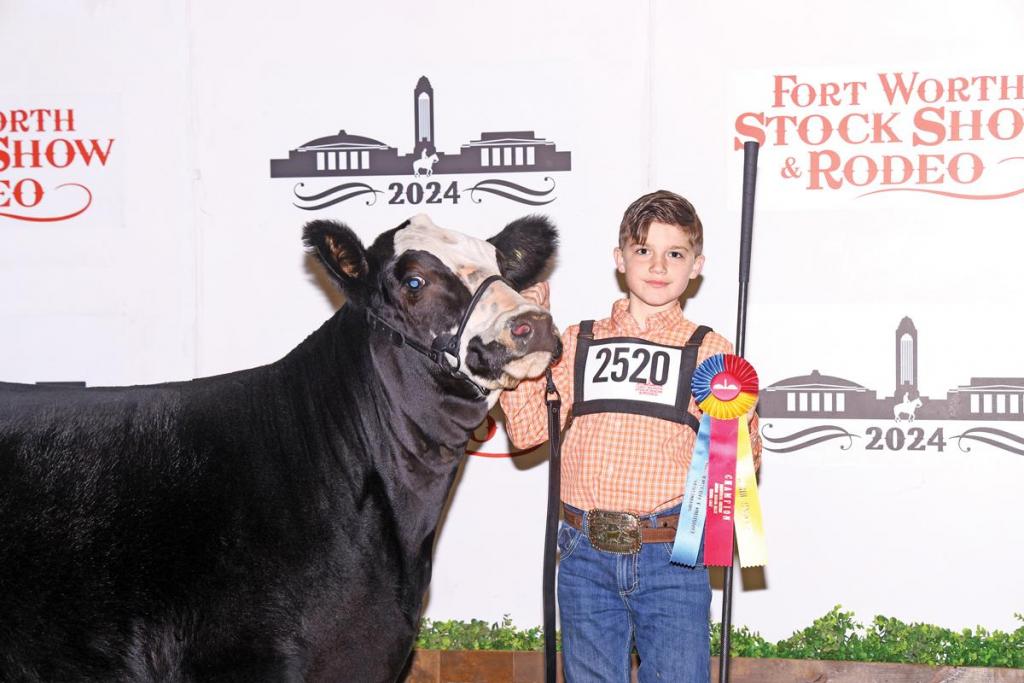 LEVI BUCHANAN, a member of Waxahachie FFA, captured Heifer Calf Champion with JSUL American Pride 3195L in the Junior Simmental Heifer Show at the 2024 Fort Worth Stock Show &amp; Rodeo (FWSSR) on January 22. The 2024 Show is hosting junior exhibitors from across Texas competing for awards and more than $34,350 in junior breeding heifer show premiums.