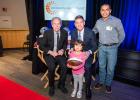 Adiela Tobar and her dad Jesse Tobar meet Honorary Co-Chairs Troy Aikman and Roger Staubach during the autograph session of the photo shoot for this year’s gala.